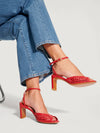 Red heeled sandals in woven leather